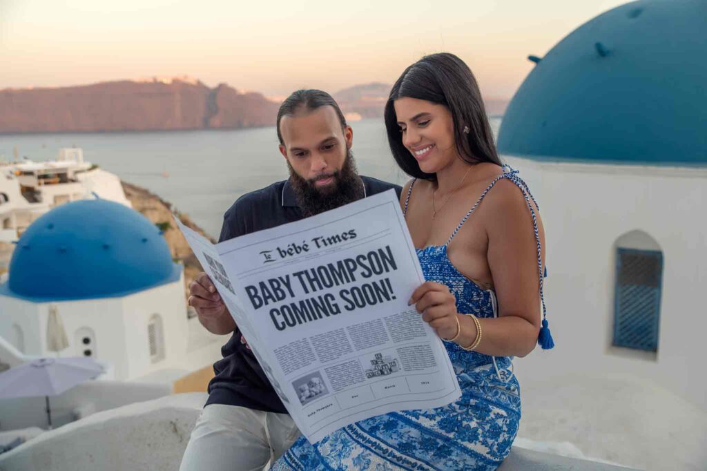 Couple reading newspaper about pregnancy.