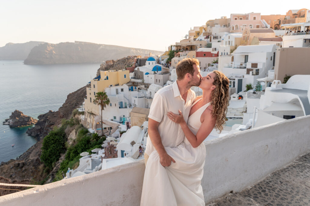 Couple kissing in Santorini sunset
