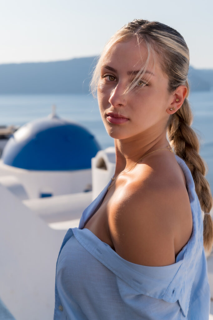 Woman with braided hair by sea